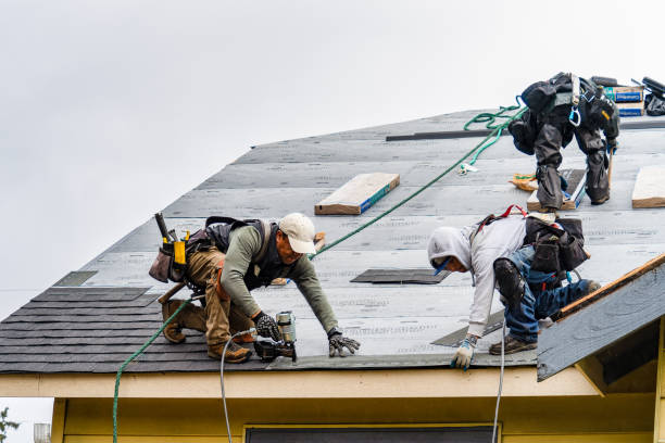 Professional Storm Damage Roof Repair technician working in New Hartford, NY